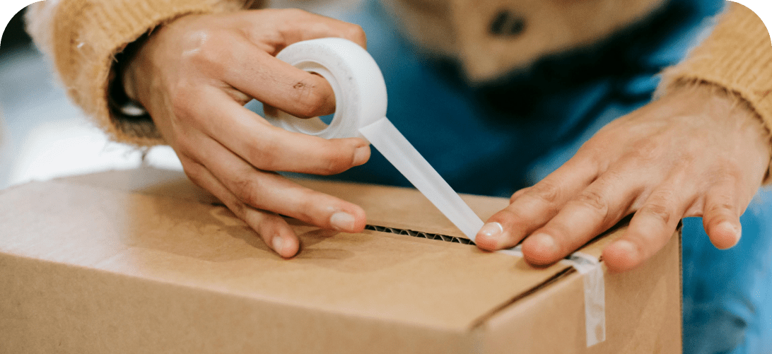Connecting independent sellers to buyers - a consumer packaging up an item to sell